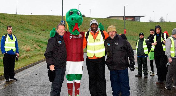 Derek Redmond walking with Jeff Stelling for Prostate Cancer Charity